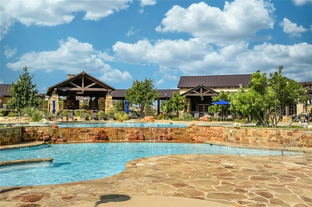 18517 Tanner Bayou Loop, Austin, TX 78738 - community pool featuring a patio area
