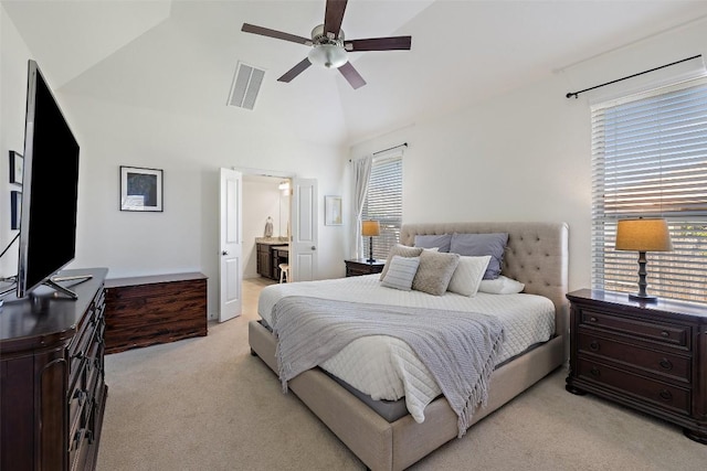 22300 Chipotle Pass, Spicewood, TX 78669 - bedroom featuring light colored carpet, high vaulted ceiling, ceiling fan, and connected bathroom