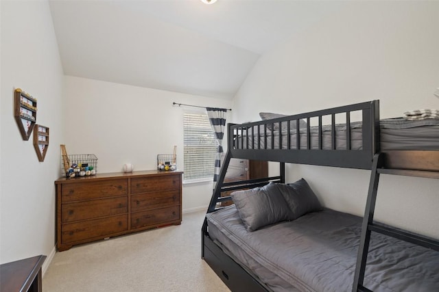 22300 Chipotle Pass, Spicewood, TX 78669 - carpeted bedroom featuring lofted ceiling and baseboards