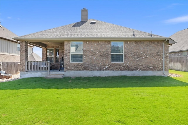 22300 Chipotle Pass, Spicewood, TX 78669 - rear view of property with brick siding, a chimney, a shingled roof, and covered porch