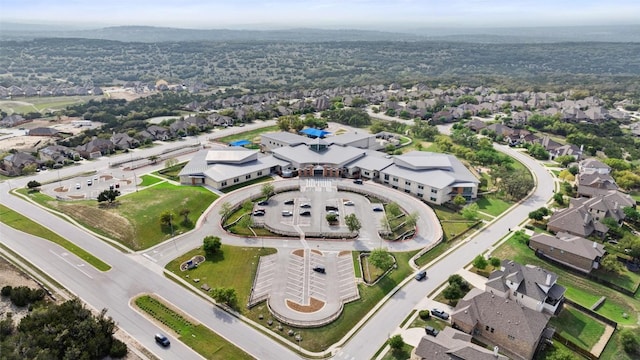 22300 Chipotle Pass, Spicewood, TX 78669 - aerial overview of property's location with nearby suburban area