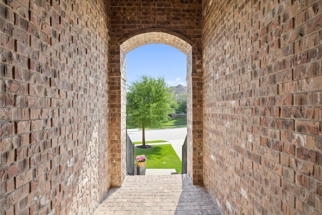 22300 Chipotle Pass, Spicewood, TX 78669 - entryway with brick wall