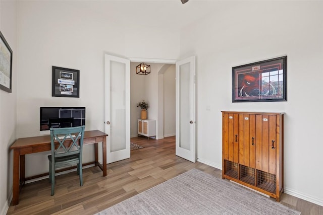 22300 Chipotle Pass, Spicewood, TX 78669 - office with wood finished floors and a chandelier