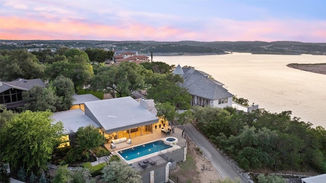 821 Malabar St, Austin, TX 78734 - aerial view at dusk of a water view and view of pool area