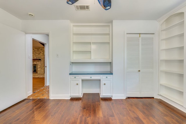 10701 Glass Mountain Trl, Austin, TX 78750 - unfurnished office featuring dark wood-type flooring and built in features