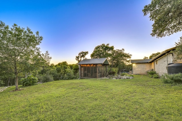 10701 Glass Mountain Trl, Austin, TX 78750 - view of green lawn featuring a sunroom