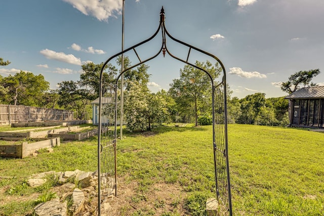 10701 Glass Mountain Trl, Austin, TX 78750 - view of grassy yard with a garden