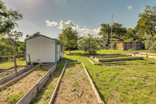 10701 Glass Mountain Trl, Austin, TX 78750 - view of yard with a vegetable garden and an outbuilding