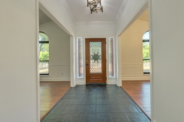10701 Glass Mountain Trl, Austin, TX 78750 - entrance foyer with plenty of natural light, dark wood-style floors, and crown molding