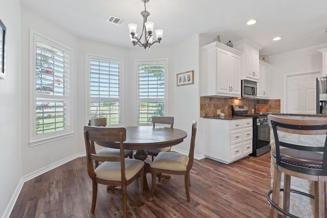 30112 Twin Creek Dr, Georgetown, TX 78626 - dining room with dark wood-type flooring, a chandelier, and recessed lighting