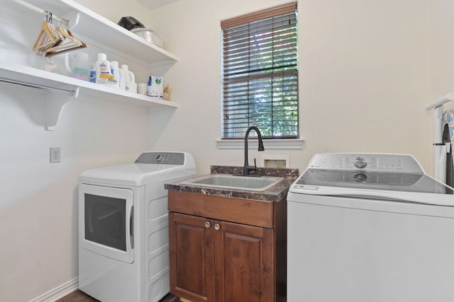 30112 Twin Creek Dr, Georgetown, TX 78626 - laundry area with separate washer and dryer, plenty of natural light, and cabinet space