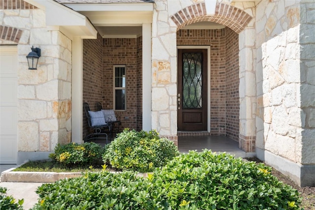 136 W Highfield St, Hutto, TX 78634 - property entrance with stone siding and brick siding