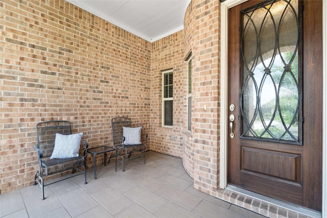 136 W Highfield St, Hutto, TX 78634 - view of exterior entry featuring brick siding