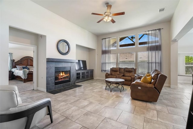 136 W Highfield St, Hutto, TX 78634 - living area with a ceiling fan and a fireplace
