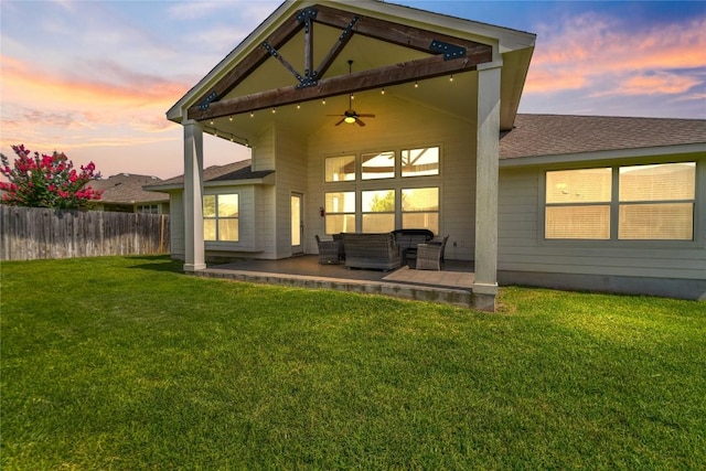 136 W Highfield St, Hutto, TX 78634 - back of house at dusk with an outdoor living space, a ceiling fan, roof with shingles, and a patio