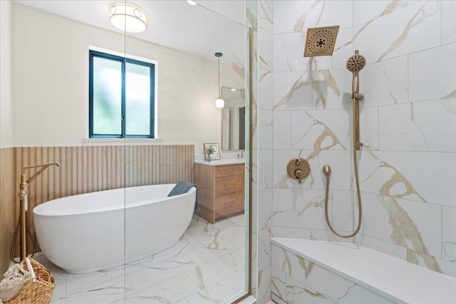 202 Hub Dr, Wimberley, TX 78676 - full bath featuring vanity, a marble finish shower, a freestanding bath, marble finish flooring, and wainscoting