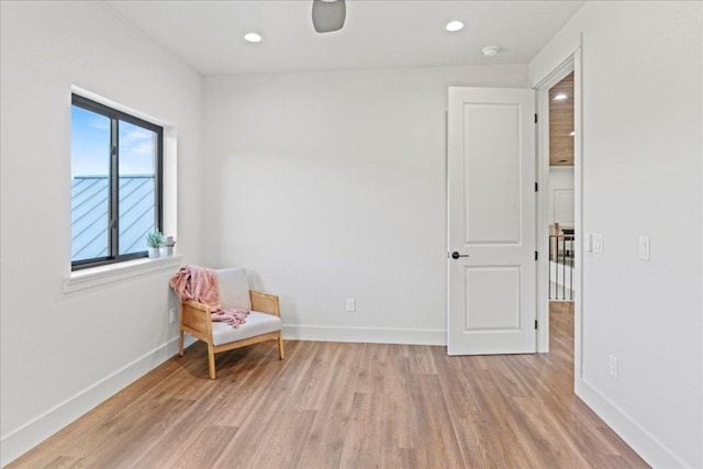 202 Hub Dr, Wimberley, TX 78676 - sitting room with light wood finished floors and recessed lighting