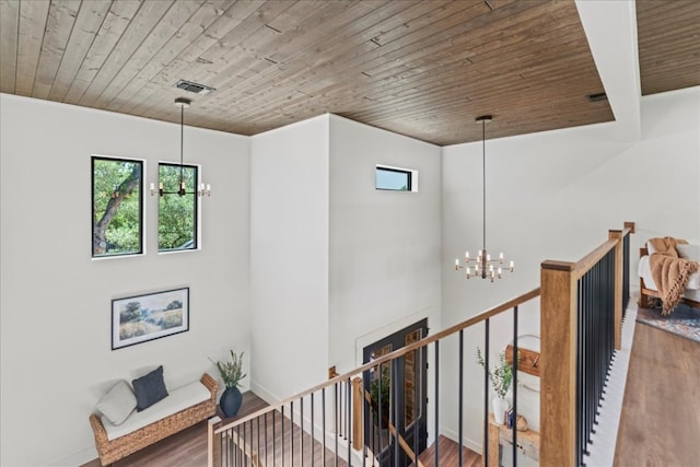 202 Hub Dr, Wimberley, TX 78676 - stairway featuring a chandelier, wooden ceiling, and wood finished floors
