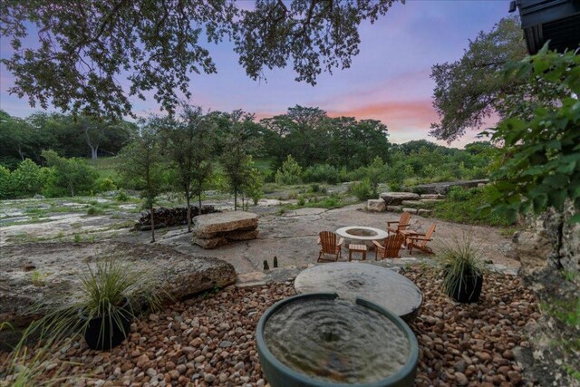202 Hub Dr, Wimberley, TX 78676 - view of yard featuring a fire pit and a patio area
