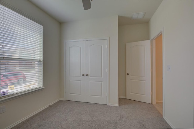 7517 Ballydawn Dr, Austin, TX 78744 - unfurnished bedroom featuring light colored carpet, a closet, and ceiling fan