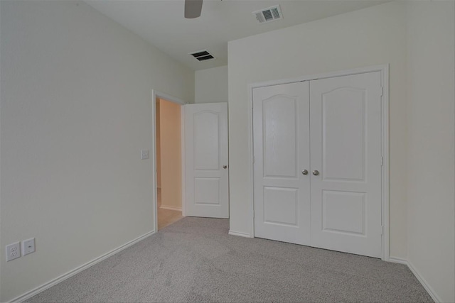 7517 Ballydawn Dr, Austin, TX 78744 - unfurnished bedroom featuring carpet, a closet, and a ceiling fan