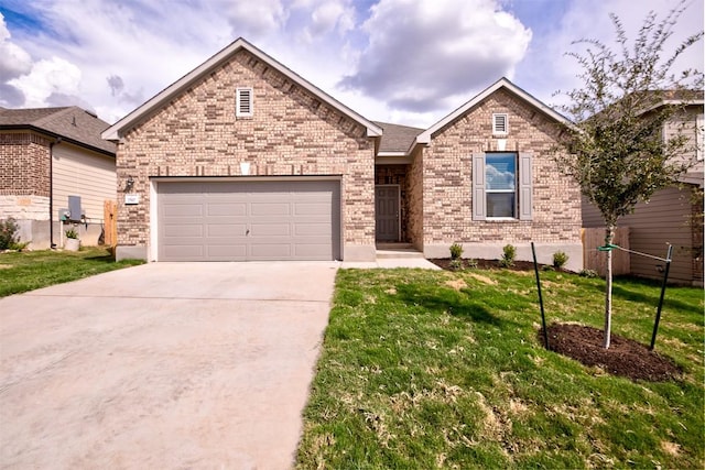 7517 Ballydawn Dr, Austin, TX 78744 - ranch-style house featuring concrete driveway, brick siding, an attached garage, and a front yard