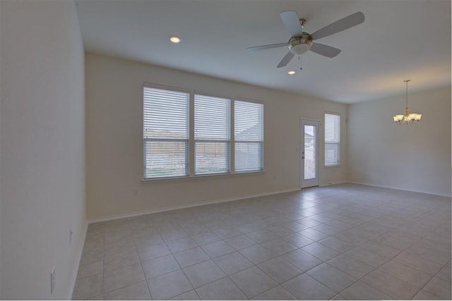7517 Ballydawn Dr, Austin, TX 78744 - spare room featuring a chandelier, light tile patterned flooring, ceiling fan, and recessed lighting