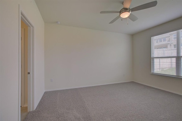 7517 Ballydawn Dr, Austin, TX 78744 - carpeted empty room with a ceiling fan and baseboards