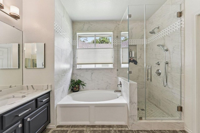 4005 Travis Country Cir, Austin, TX 78735 - full bath featuring a bath, vanity, and a stall shower