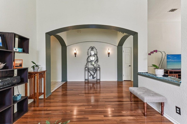 4005 Travis Country Cir, Austin, TX 78735 - hallway featuring arched walkways and wood finished floors