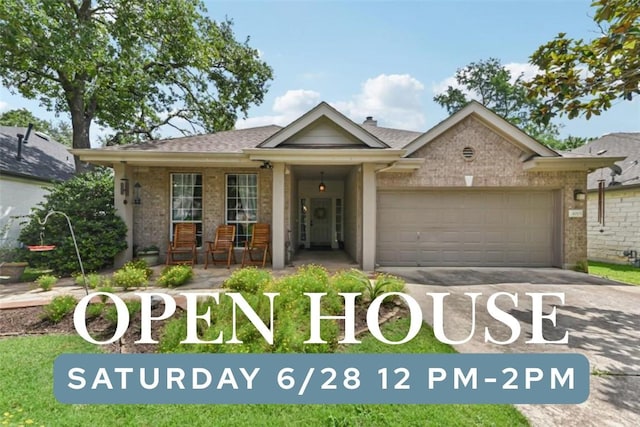 4005 Travis Country Cir, Austin, TX 78735 - view of front of house with brick siding, an attached garage, concrete driveway, and a porch