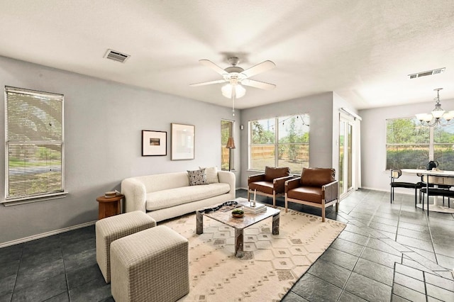 4460 Bremner Dr, Austin, TX 78749 - living room with a chandelier and a ceiling fan