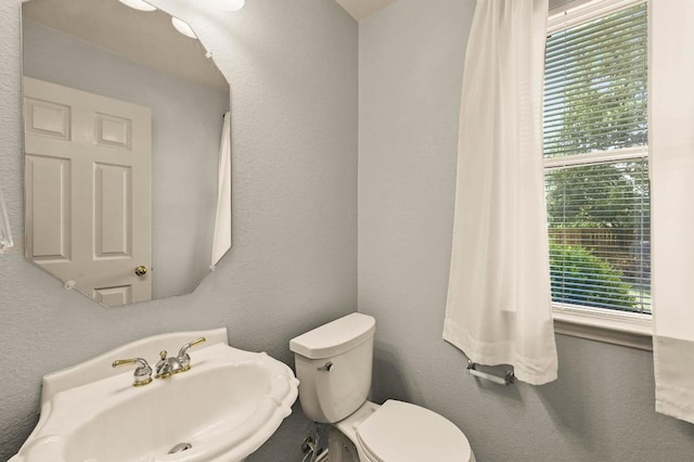 4460 Bremner Dr, Austin, TX 78749 - half bathroom with a sink and toilet