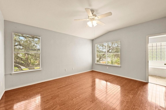 4460 Bremner Dr, Austin, TX 78749 - unfurnished room featuring wood-type flooring, a ceiling fan, and lofted ceiling