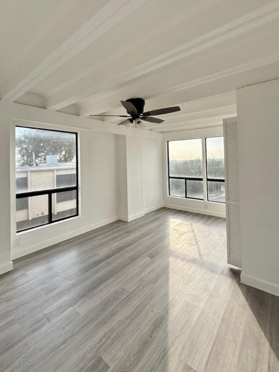 5916 Lago Vista Way Unit B16, Leander, TX 78645 - unfurnished room with beam ceiling, wood finished floors, and a ceiling fan