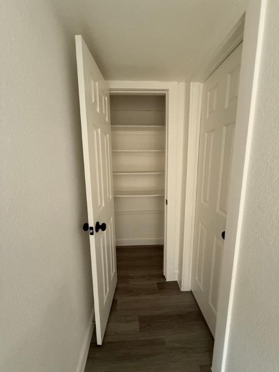 5916 Lago Vista Way Unit B16, Leander, TX 78645 - corridor featuring dark wood-style flooring and baseboards