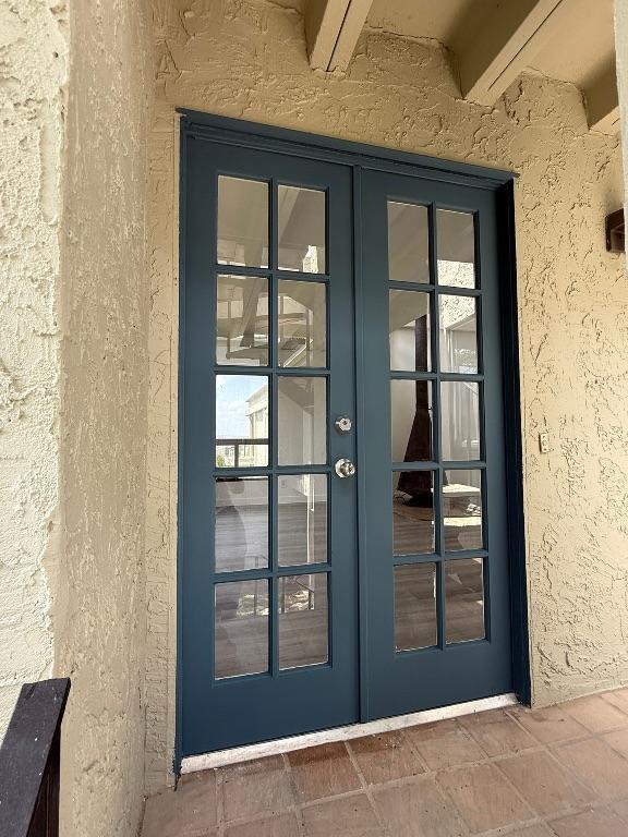 5916 Lago Vista Way Unit B16, Leander, TX 78645 - doorway to property with french doors and stucco siding