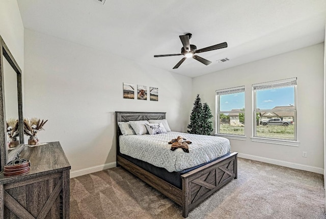 312 First Down Dash, Bertram, TX 78611 - carpeted bedroom featuring baseboards and a ceiling fan
