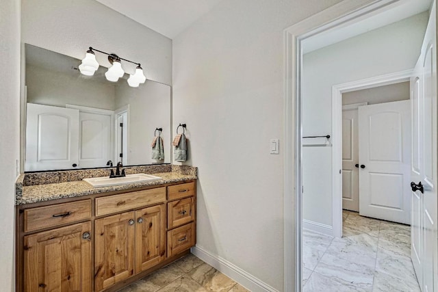 312 First Down Dash, Bertram, TX 78611 - bathroom with marble look tiles and vanity