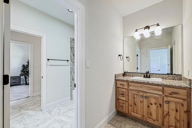 312 First Down Dash, Bertram, TX 78611 - bathroom with marble finish floors, vanity, and shower / bath combination with curtain
