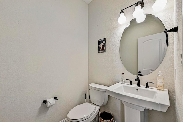 312 First Down Dash, Bertram, TX 78611 - half bathroom featuring toilet and a textured wall
