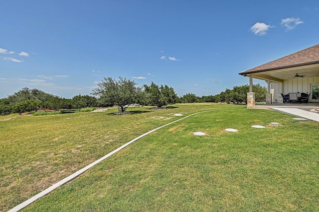 312 First Down Dash, Bertram, TX 78611 - view of green lawn with ceiling fan and a patio