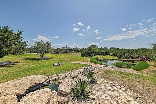 312 First Down Dash, Bertram, TX 78611 - view of green lawn featuring a water view