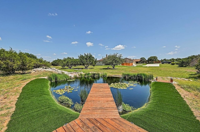 312 First Down Dash, Bertram, TX 78611 - dock featuring a water view and a lawn