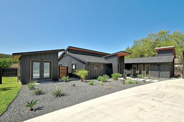 12501 Mixson Dr, Austin, TX 78732 - view of front of home featuring board and batten siding and french doors