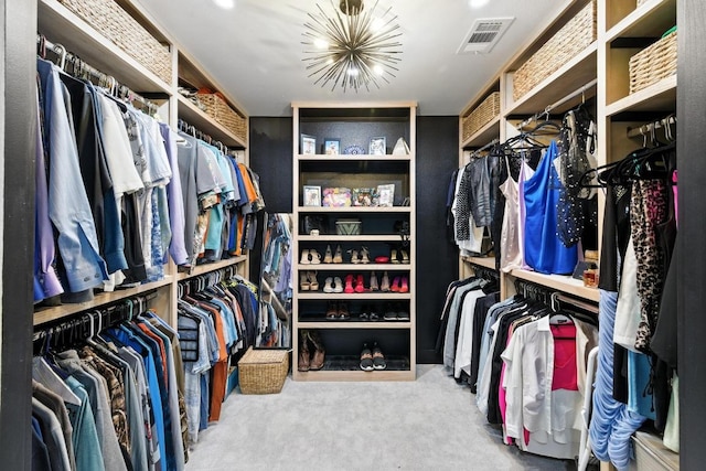 12501 Mixson Dr, Austin, TX 78732 - walk in closet with carpet and a chandelier