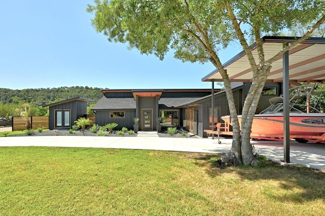 12501 Mixson Dr, Austin, TX 78732 - view of front facade with board and batten siding