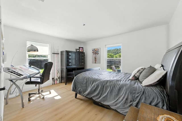 12501 Mixson Dr, Austin, TX 78732 - bedroom featuring wood finished floors and a desk