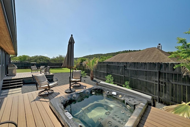 12501 Mixson Dr, Austin, TX 78732 - deck featuring an outdoor hot tub and a fenced backyard