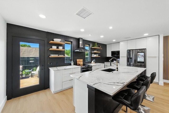12501 Mixson Dr, Austin, TX 78732 - kitchen featuring wall chimney exhaust hood, open shelves, range with electric stovetop, white cabinetry, and recessed lighting